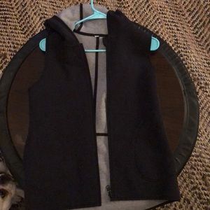 Reversible black and grey zip up vest with hood
